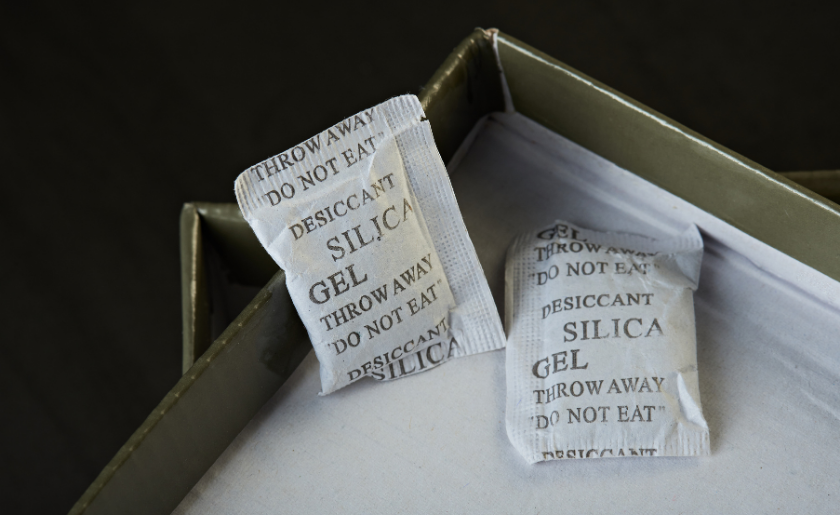 package of silica gel laying in an opened box