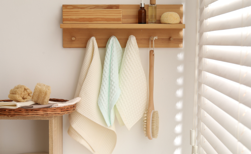Floating shelf with hooks in bathroom