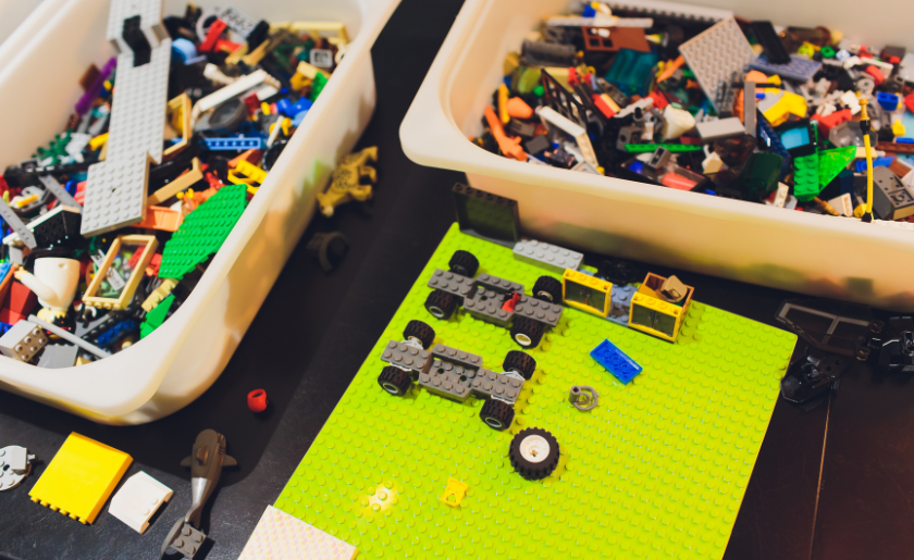 Scattered LEGO sets in containers