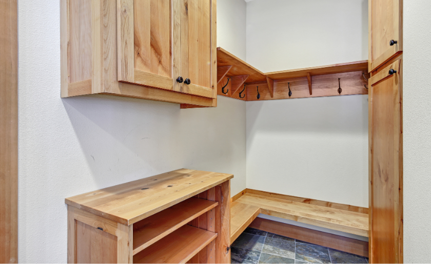 Corner mudroom with wood furniture