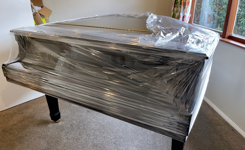 Grand piano wrapped for storage