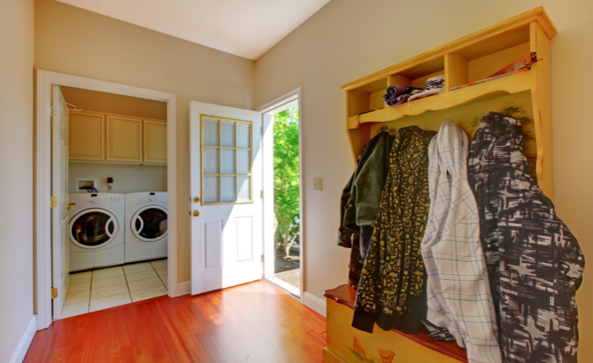 Laundry room with mud room and clothes.
