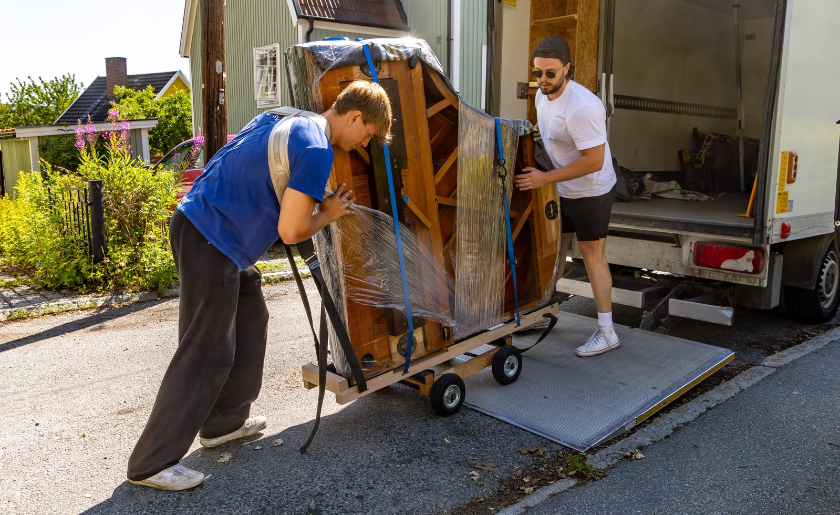 Moving a grand piano unto a truck