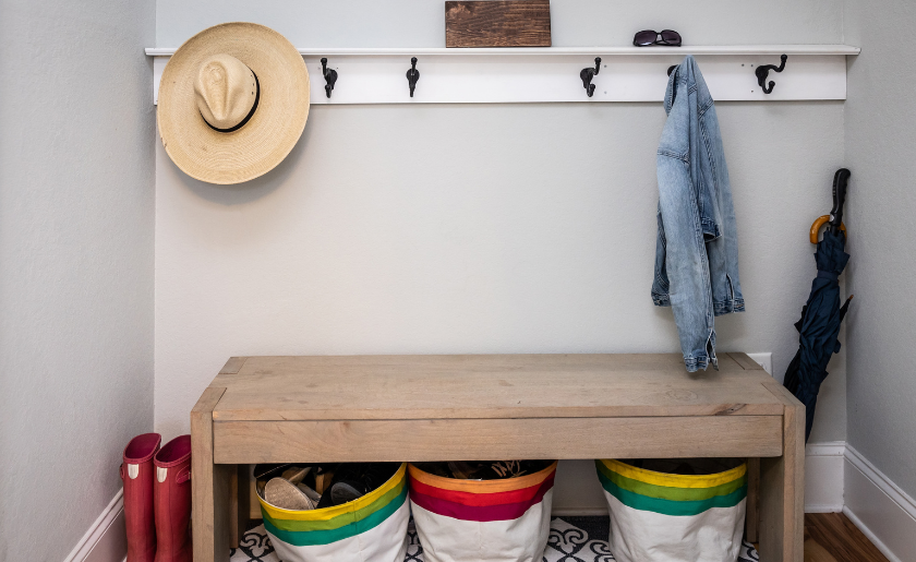 Mudroom with hooks, bench, baskets underneath