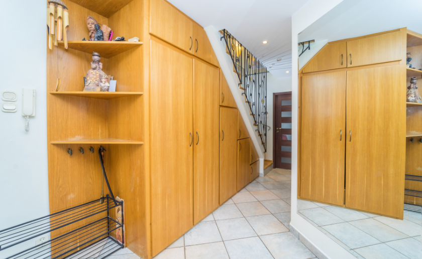 Under-stairs storage in entryway