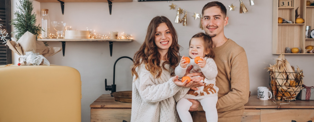 Family in holiday decorated house.